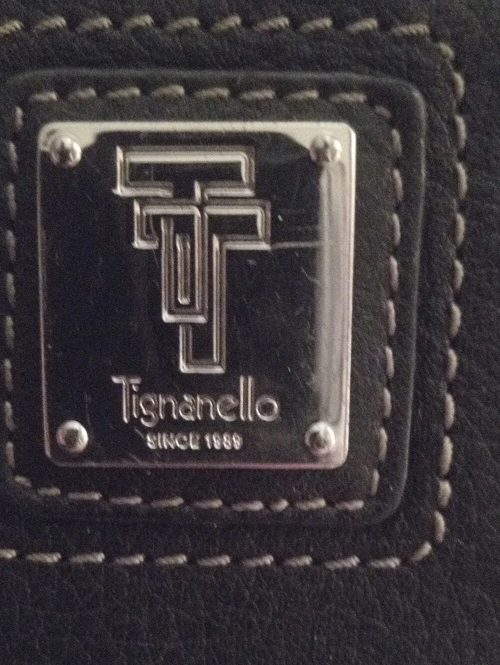 Tignanello Black Leather Zip Around Wallet with Metal Logo Plate
